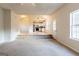 Light-filled living area with steps leading to a modern kitchen and a cozy ambiance at 2536 Lancewood Ln, Lithonia, GA 30058