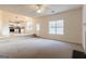 Inviting living room with an open floor plan leading to a bright kitchen and outdoor access at 2536 Lancewood Ln, Lithonia, GA 30058