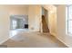 Spacious living room with open floor plan and staircase at 2536 Lancewood Ln, Lithonia, GA 30058