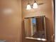 Bright bathroom boasting a large mirror, sconce lighting, and neutral walls for a clean and inviting space at 107 Heatherwood Trce, Acworth, GA 30101