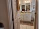 Bathroom featuring a granite countertop, double vanity, tiled shower, and white cabinets at 107 Heatherwood Trce, Acworth, GA 30101