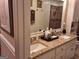 Bathroom featuring a granite countertop, double vanity, tiled shower, and white cabinets at 107 Heatherwood Trce, Acworth, GA 30101