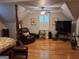 Spacious bedroom featuring hardwood floors, tray ceiling with a ceiling fan, and recessed lighting at 107 Heatherwood Trce, Acworth, GA 30101