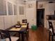 Cozy eat-in kitchen area with hardwood floors, a table, and large shuttered windows at 107 Heatherwood Trce, Acworth, GA 30101