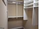 Spacious walk-in closet featuring multiple shelving units and hanging rods at 107 Heatherwood Trce, Acworth, GA 30101