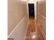 Hallway with wood floors and wainscoting leading towards the bedroom at 107 Heatherwood Trce, Acworth, GA 30101