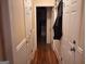 Hallway with hardwood floors, white wainscoting, and doors at 107 Heatherwood Trce, Acworth, GA 30101