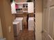 Well-organized laundry room with white cabinets, shelving, and appliances, offering convenience and ample storage at 107 Heatherwood Trce, Acworth, GA 30101