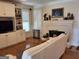 Comfortable living room with a fireplace, built-in shelving and hardwood floors at 107 Heatherwood Trce, Acworth, GA 30101