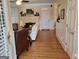 Inviting living room featuring hardwood floors, fireplace, and white wainscoting at 107 Heatherwood Trce, Acworth, GA 30101