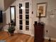 Cozy living room boasts hardwood floors, glass paneled closet, and decorator touches at 107 Heatherwood Trce, Acworth, GA 30101