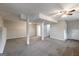 Large finished basement area with neutral carpeting, ceiling fans, and plenty of space at 203 Greensprings Dr, Palmetto, GA 30268