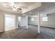 Expansive finished basement with support columns, soft carpeting, and multiple rooms at 203 Greensprings Dr, Palmetto, GA 30268