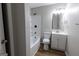 Modern bathroom featuring a shower-tub combo, updated vanity, fixtures, and new flooring at 203 Greensprings Dr, Palmetto, GA 30268