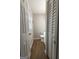 Cozy bathroom with updated fixtures, warm wood-look flooring, and ample natural light from the window at 203 Greensprings Dr, Palmetto, GA 30268