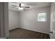 Bright bedroom featuring a ceiling fan, plush carpeting, and a window that provides natural light at 203 Greensprings Dr, Palmetto, GA 30268