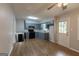 Modern kitchen with sleek blue cabinets, stainless steel appliances, and plenty of counter space at 203 Greensprings Dr, Palmetto, GA 30268
