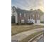Traditional brick home featuring a two-car garage, front porch, and well-manicured lawn at 3731 Patti Pkwy, Decatur, GA 30034