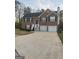 Charming two-story brick home with a two-car garage and inviting front porch at 3731 Patti Pkwy, Decatur, GA 30034