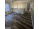 Elegant living room featuring hardwood floors and decorative wall paneling in a neutrally painted color scheme at 3731 Patti Pkwy, Decatur, GA 30034