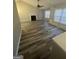 Open-concept living room with a cozy fireplace, vaulted ceilings, and natural lighting at 3731 Patti Pkwy, Decatur, GA 30034