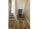 Staircase with new wood look floors and white railings leads to the lower level of the home at 3731 Patti Pkwy, Decatur, GA 30034