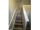 Staircase with new wood look floors and white railings leads to the upper level of the home at 3731 Patti Pkwy, Decatur, GA 30034