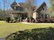 Spacious backyard with a patio, fire pit, and ample space for outdoor activities at 711 Lily Glen Ln, Stockbridge, GA 30281
