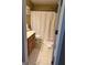 Bathroom featuring a vanity, toilet, shower with curtain, and flooring at 711 Lily Glen Ln, Stockbridge, GA 30281