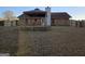 A backyard featuring a brick house with a picnic pavilion and a grassy lawn at 634 S Jeff Davis Dr, Fayetteville, GA 30215