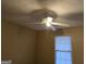 The bedroom includes a ceiling fan and a window, providing a comfortable atmosphere at 634 S Jeff Davis Dr, Fayetteville, GA 30215