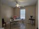 Bedroom is staged as an office featuring a ceiling fan, a window and tile floors at 634 S Jeff Davis Dr, Fayetteville, GA 30215