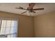Bedroom with a ceiling fan and light fixture near a window with blinds for ambient lighting at 634 S Jeff Davis Dr, Fayetteville, GA 30215