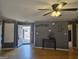 Spacious living room with hardwood floors, neutral gray walls, and an open doorway to the outside at 634 S Jeff Davis Dr, Fayetteville, GA 30215