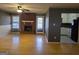 An open living room includes a brick fireplace and hardwood floors and connects to the kitchen at 634 S Jeff Davis Dr, Fayetteville, GA 30215