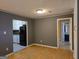 An open living room includes hardwood floors and offers access to the kitchen and bedroom areas at 634 S Jeff Davis Dr, Fayetteville, GA 30215