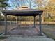 Outdoor pavilion with picnic table and brick columns provides a relaxing outdoor space at 634 S Jeff Davis Dr, Fayetteville, GA 30215