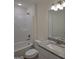 Full bathroom featuring a shower-tub combo, white cabinets, and granite vanity at 22638 Salem Church Rd, Metter, GA 30349