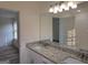 Bright bathroom with double vanity and granite countertops at 22638 Salem Church Rd, Metter, GA 30349