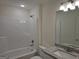 Full bathroom featuring a shower-tub combo, white cabinets, and granite vanity at 22638 Salem Church Rd, Metter, GA 30349