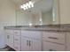 Bathroom featuring a double vanity with granite countertops and white cabinets at 22638 Salem Church Rd, Metter, GA 30349