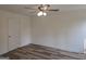 This bright bedroom features vinyl flooring and a ceiling fan at 22638 Salem Church Rd, Metter, GA 30349