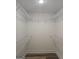 Walk-in closet featuring shelving for organized storage at 22638 Salem Church Rd, Metter, GA 30349