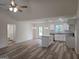 Open floor plan featuring a kitchen with an island, white cabinets, and granite countertops at 22638 Salem Church Rd, Metter, GA 30349