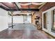 Basement with exposed utilities, brick fireplace and white french doors at 509 Eskew Rd, Mcdonough, GA 30252