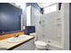 Bathroom featuring a white vanity, toilet and standing shower at 509 Eskew Rd, Mcdonough, GA 30252
