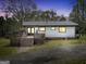 Charming single-story home with a welcoming deck and a metal roof, nestled in a wooded setting at 509 Eskew Rd, Mcdonough, GA 30252