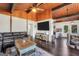 Comfortable living room with a beamed ceiling, hardwood floors, and a view to the kitchen at 509 Eskew Rd, Mcdonough, GA 30252
