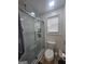 Contemporary bathroom showcasing tiled shower with glass door and a modern toilet at 5802 Bay Pointe Sound Nw, Acworth, GA 30101