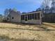 Charming single-story home featuring a large yard and screened porch at 5802 Bay Pointe Sound Nw, Acworth, GA 30101